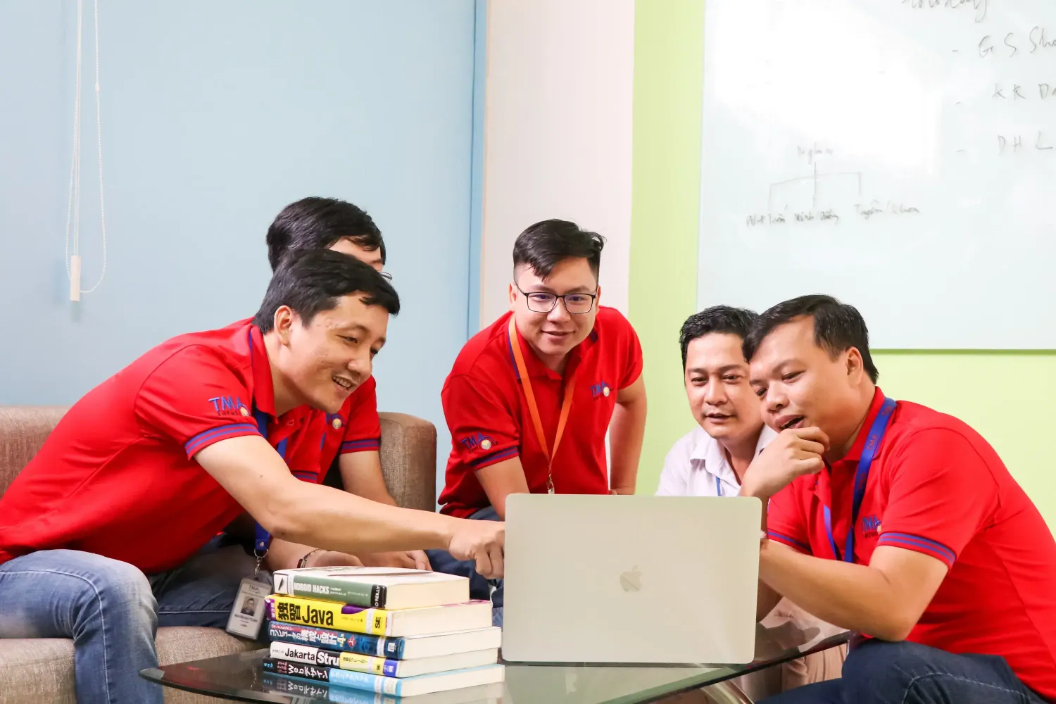 TMA's employees are in a meeting room
